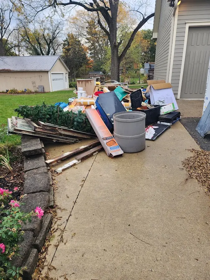 Dumpster being loaded with debris for Roofing Dumpster Rental in Mount Carmel